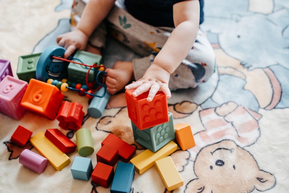 A child playing with LEGO blocks